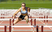 runner jumping hurdles